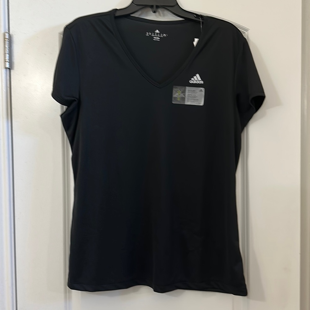 Black check performance material shirt.